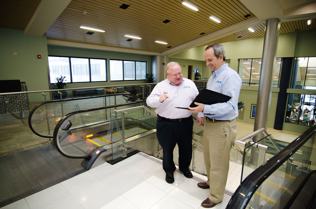 PARKER W. MCCLELLAN JR., A.A.E. and  RICHARD A. MCCONNELL, A.A.E. discussing some information in the airport