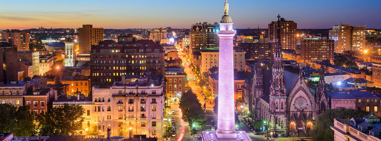 Baltimore, Maryland skyline and waterfront at twilight.